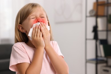 Suffering from allergy. Little girl with tissue sneezing at home, space for text