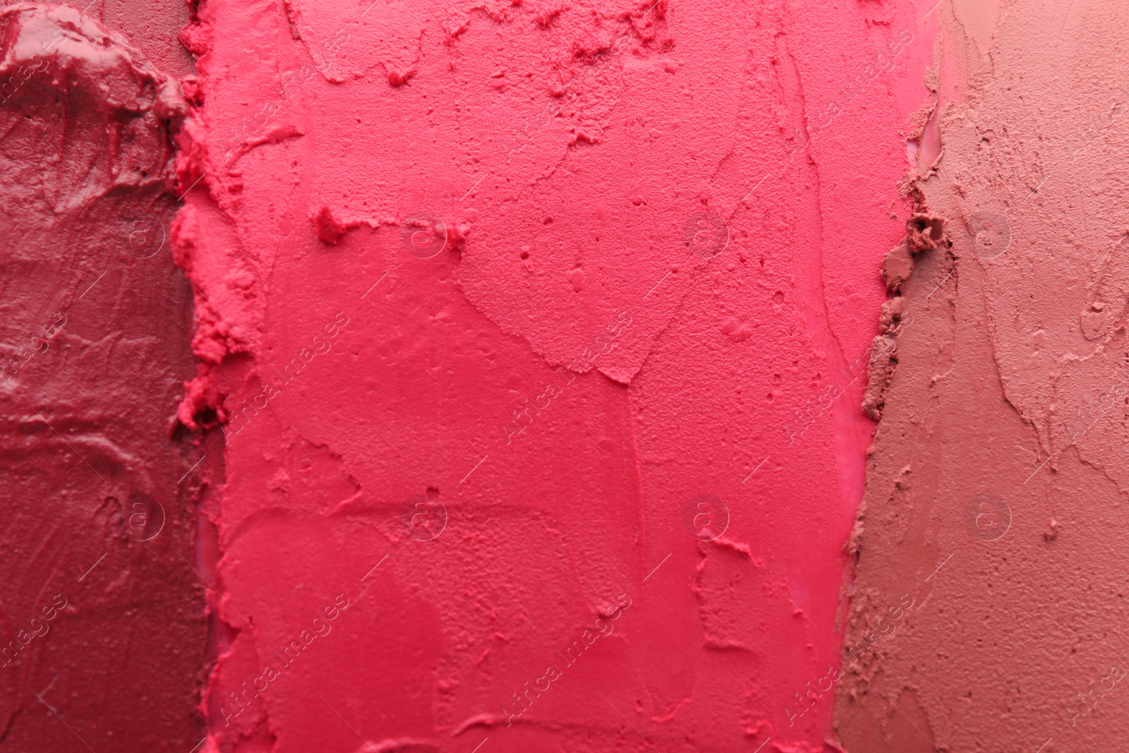 Photo of Texture of different lipsticks as background, closeup