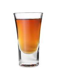 Photo of Shot glass with tasty amaretto liqueur isolated on white