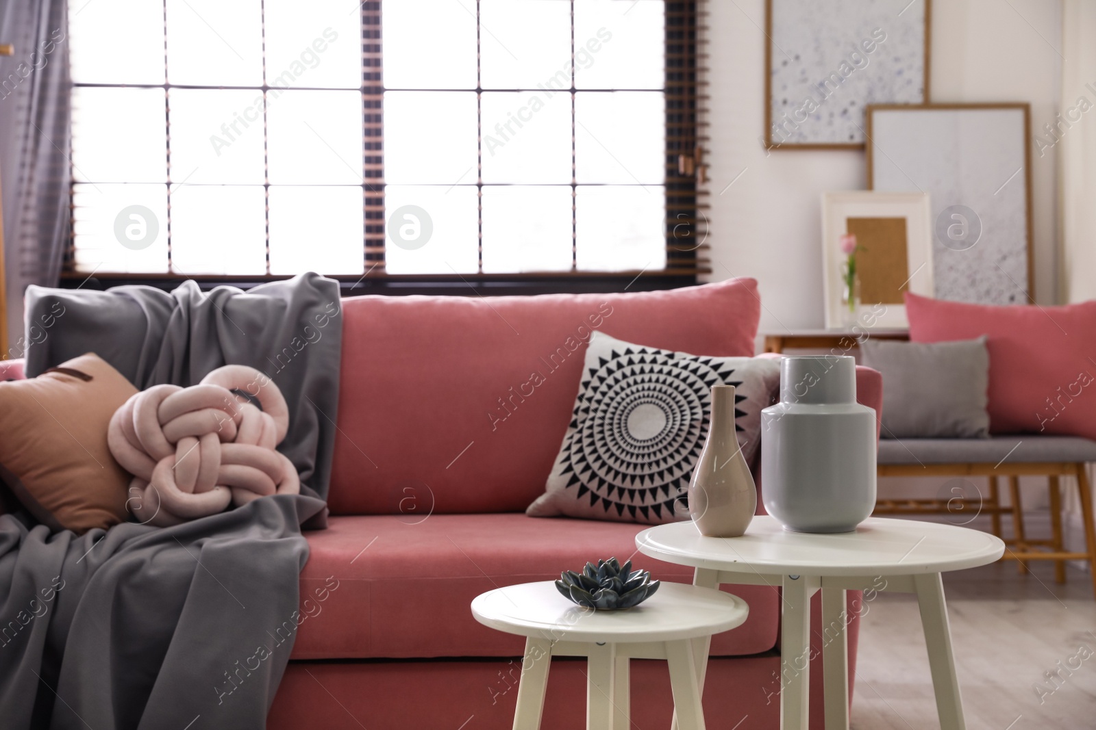 Photo of Interior of cozy living room with comfortable sofa