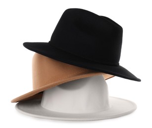 Photo of Stylish hats isolated on white. Trendy headdress