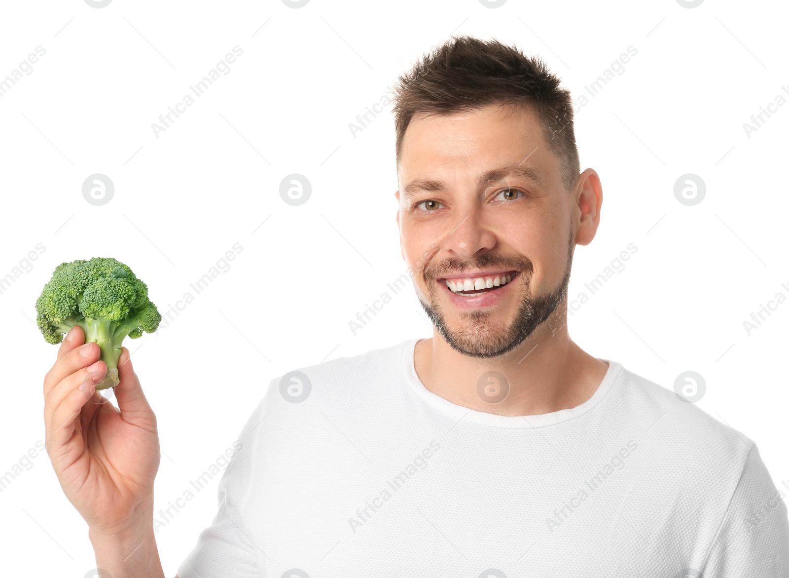 Photo of Portrait of happy man with broccoli on white background