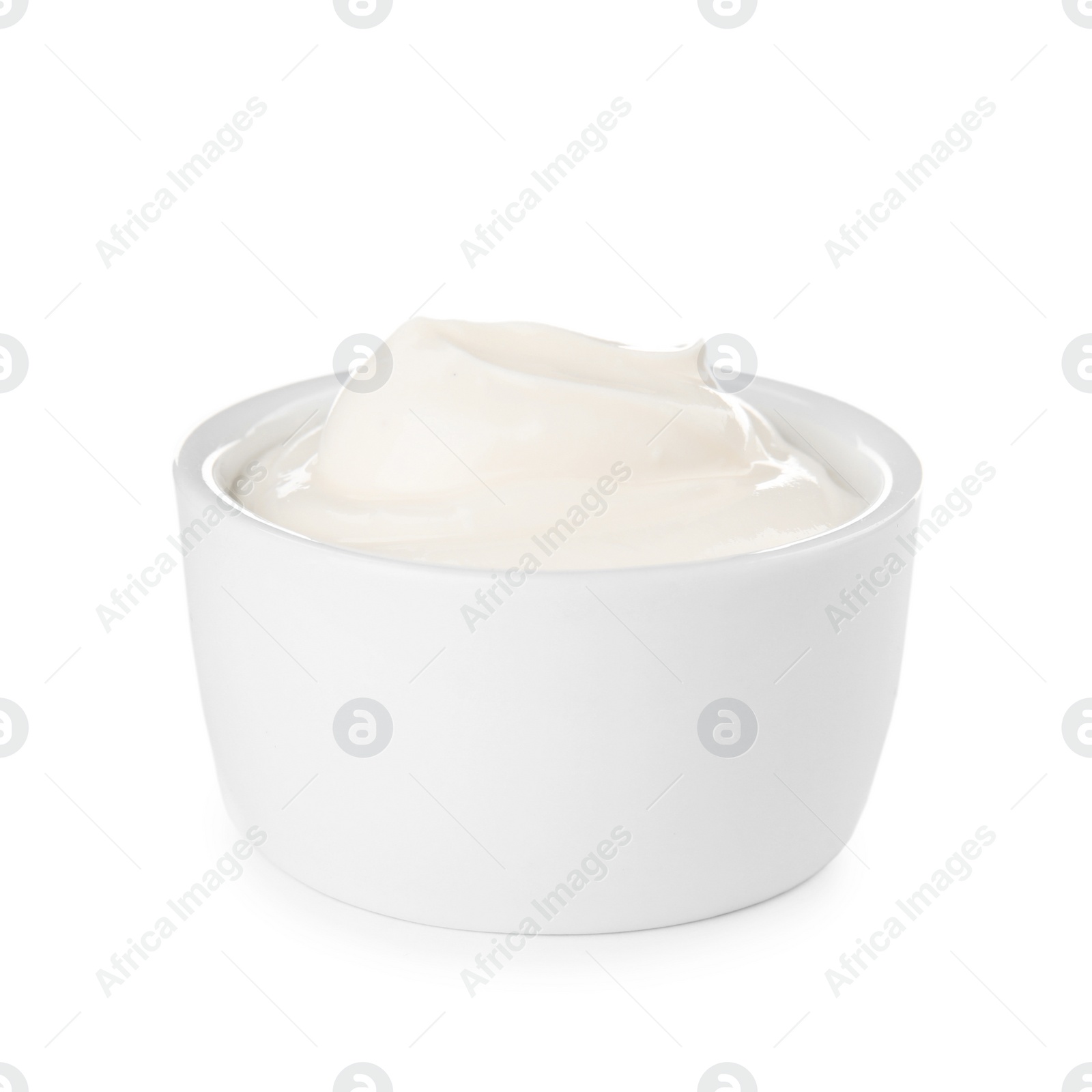 Photo of Bowl with sour cream on white background