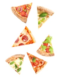 Image of Pieces of different pizzas falling on white background