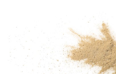 Photo of Pile of brown dust scattered on white background, top view