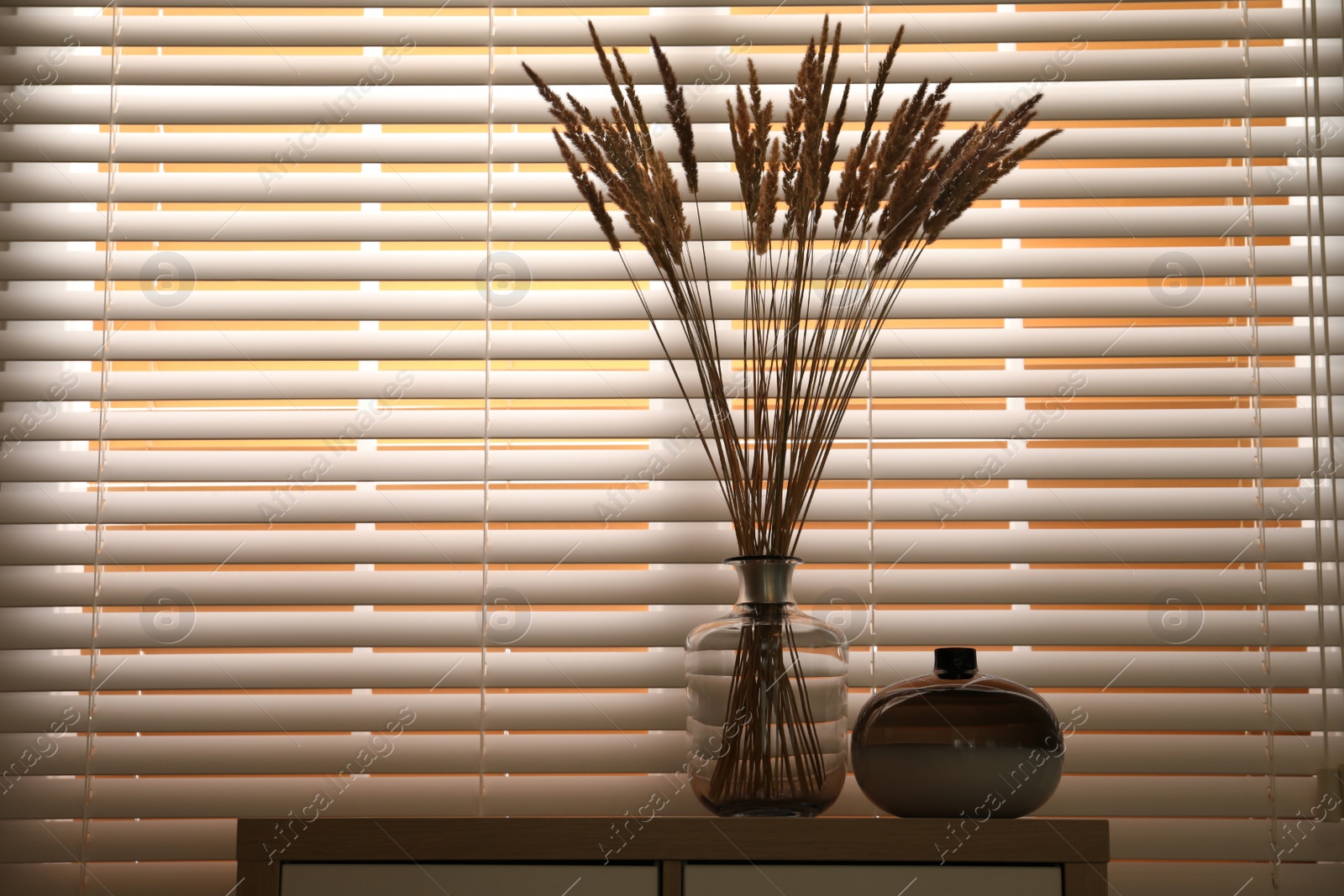 Photo of Decorative vases on commode near window indoors, space for text