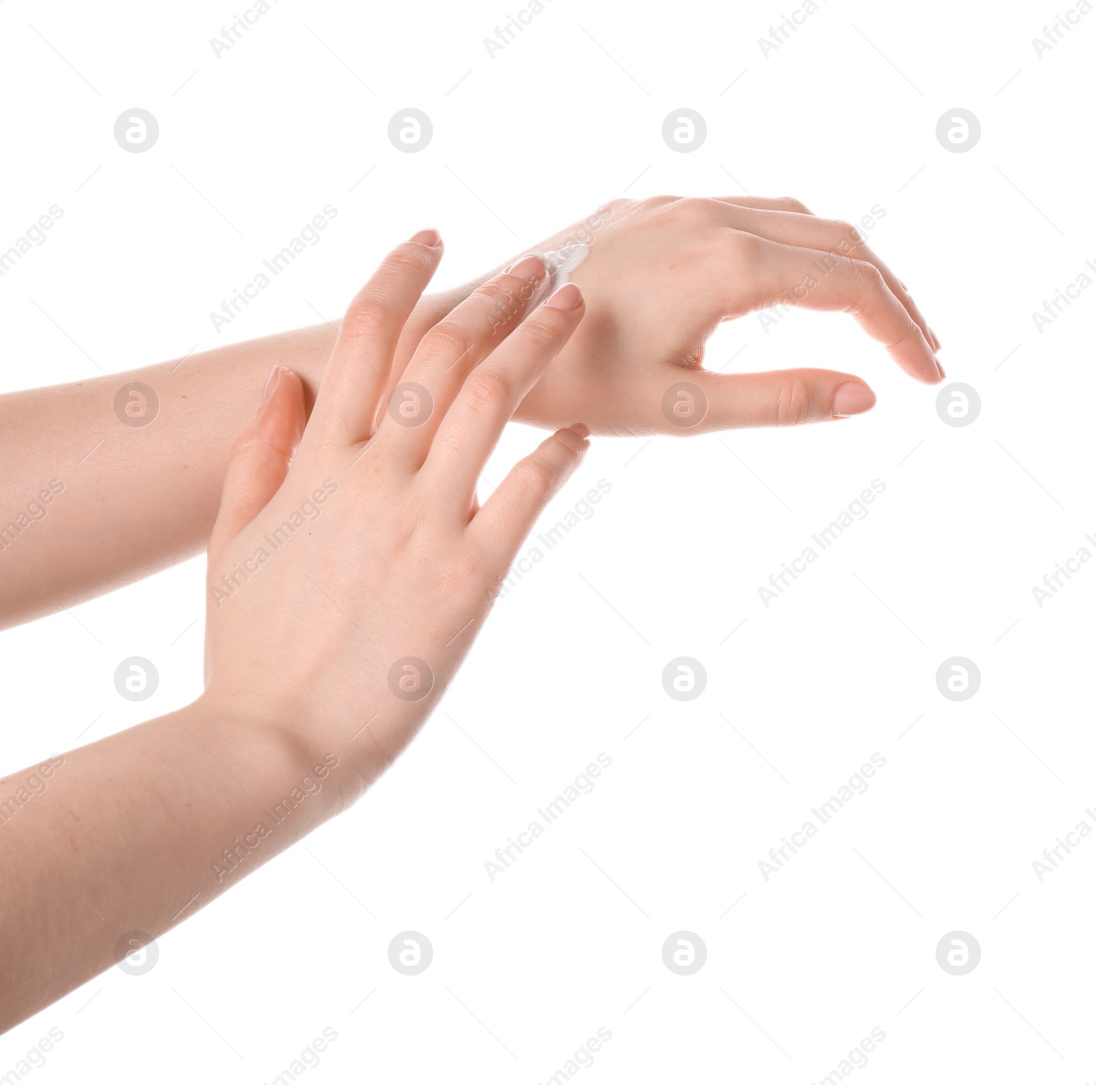 Photo of Woman applying cream on her hand against white background, closeup