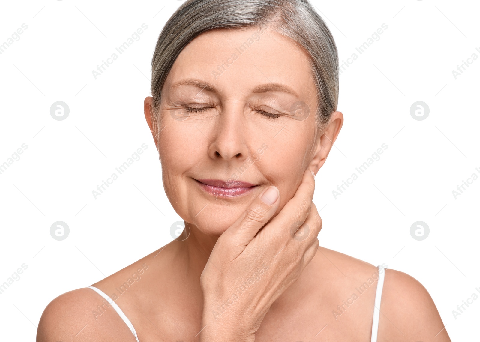 Photo of Portrait of senior woman with aging skin on white background. Rejuvenation treatment