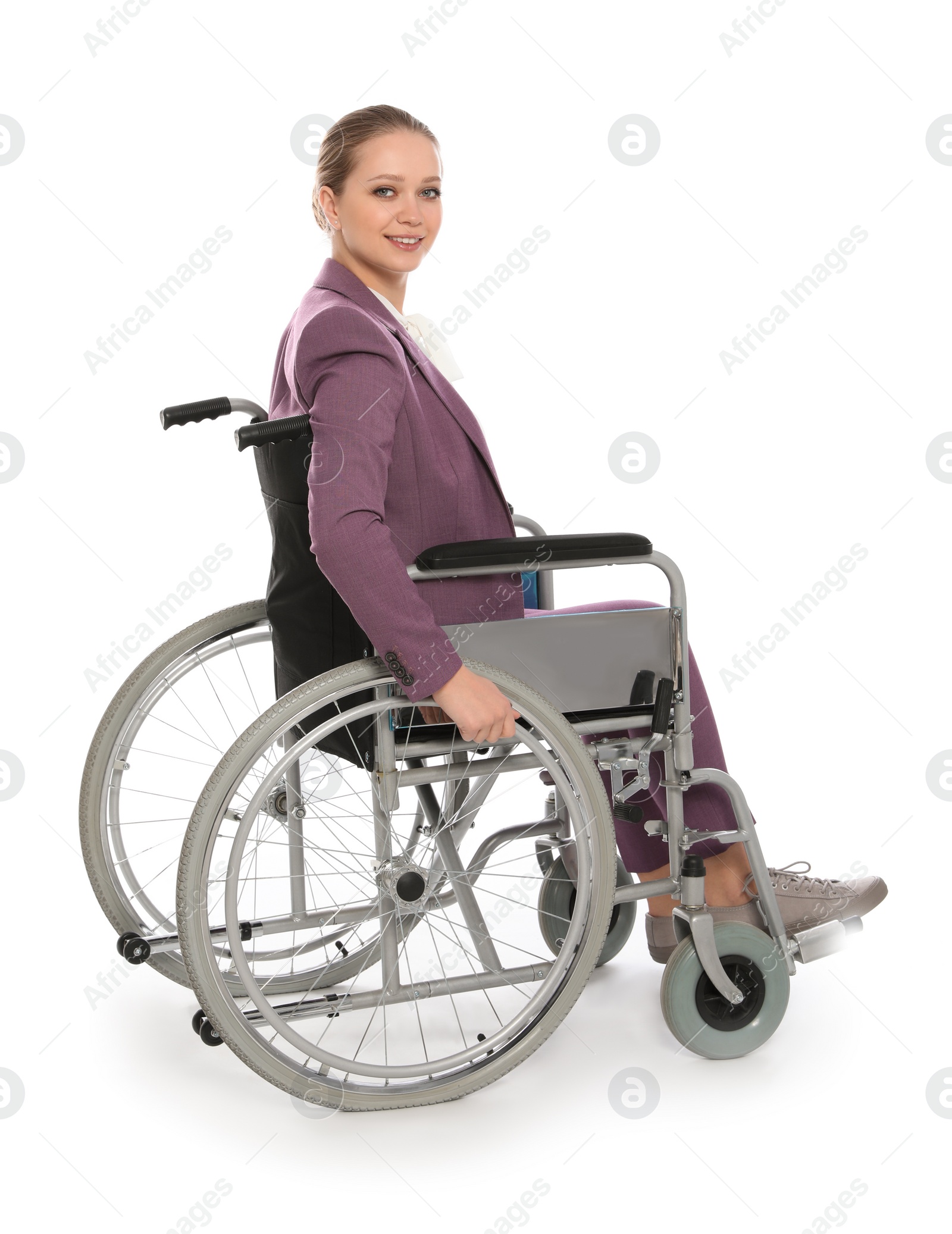 Photo of Beautiful young businesswoman in wheelchair isolated on white