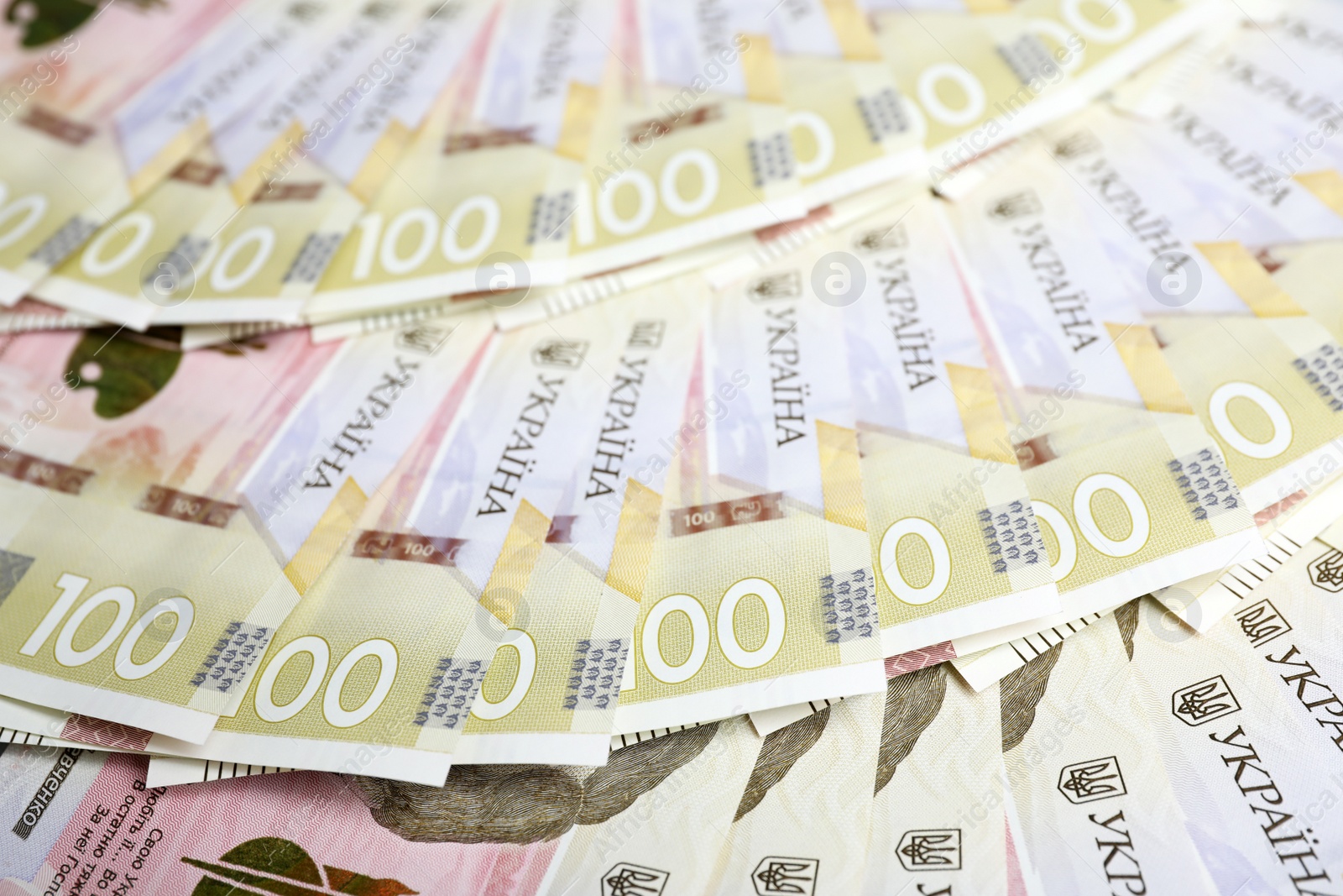 Photo of Closeup view of Ukrainian money as background. National currency