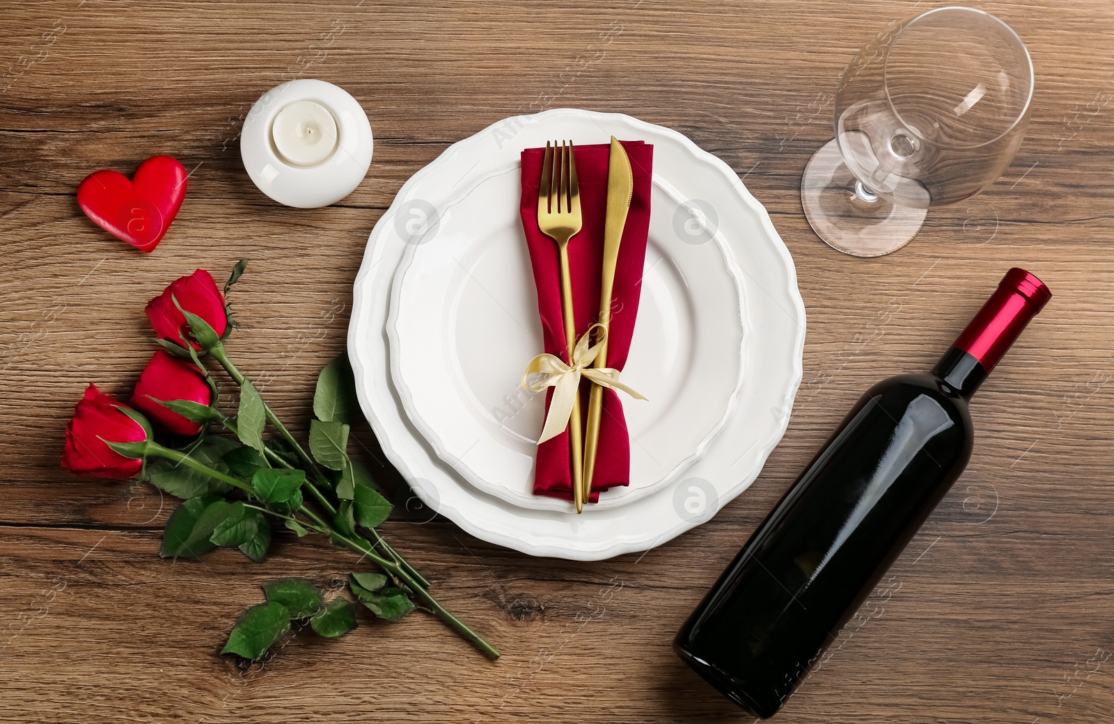 Photo of Beautiful table setting for Valentine's Day dinner on wooden background, flat lay