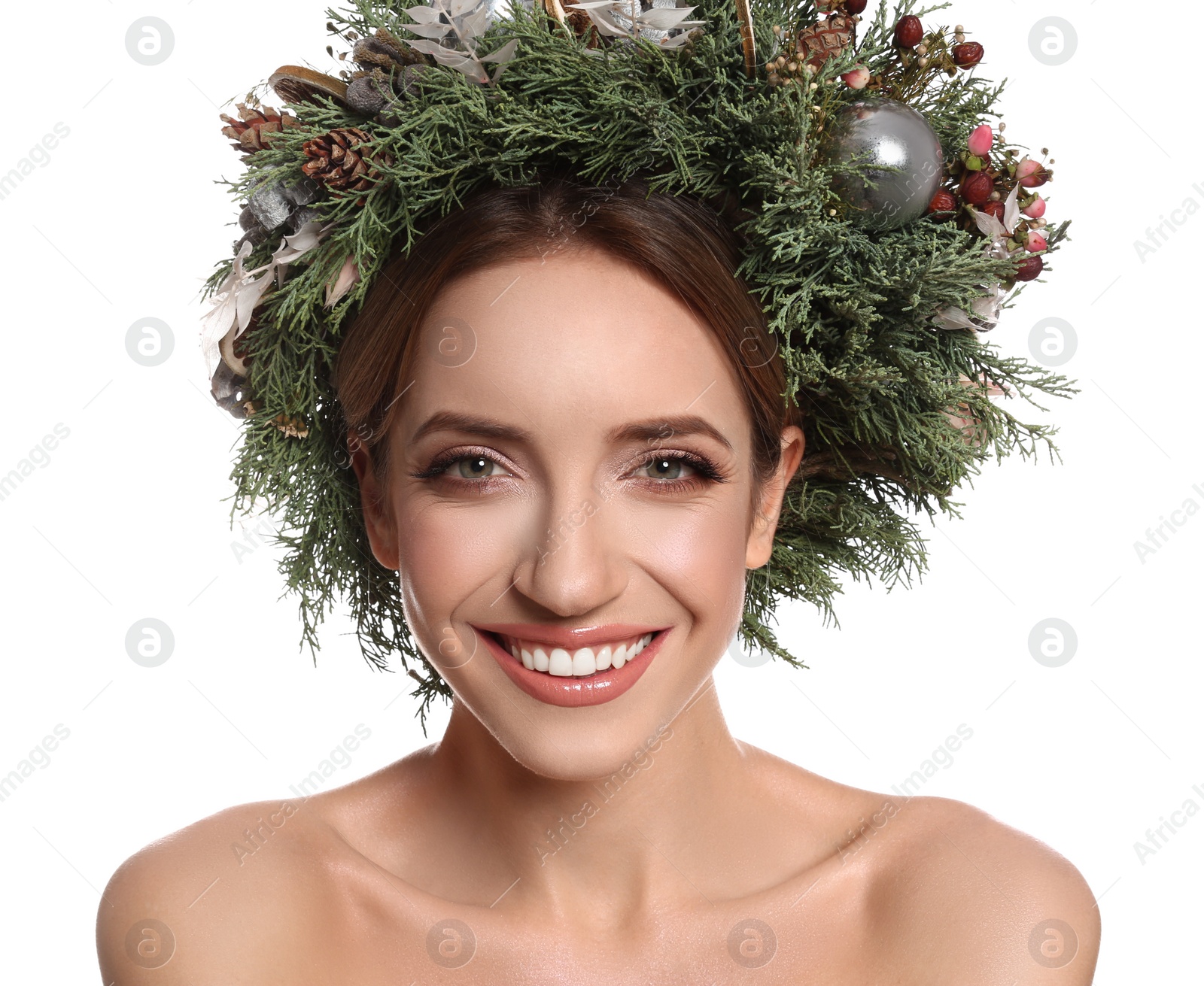 Photo of Beautiful young woman wearing Christmas wreath on white background