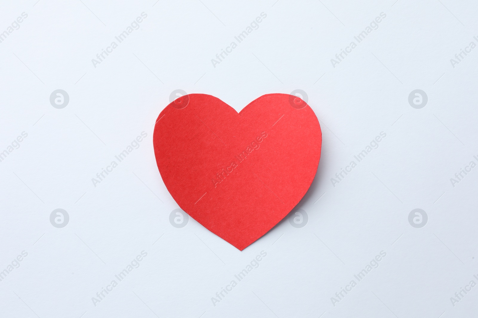 Photo of One paper heart on white background, top view