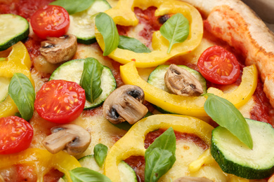 Delicious hot vegetable pizza with mushrooms as background, closeup