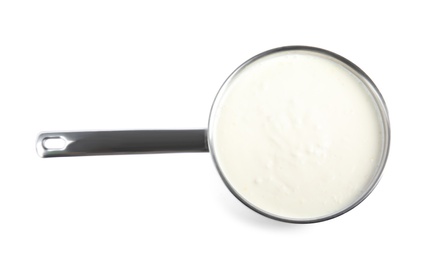 Delicious creamy sauce in pan on white background, top view