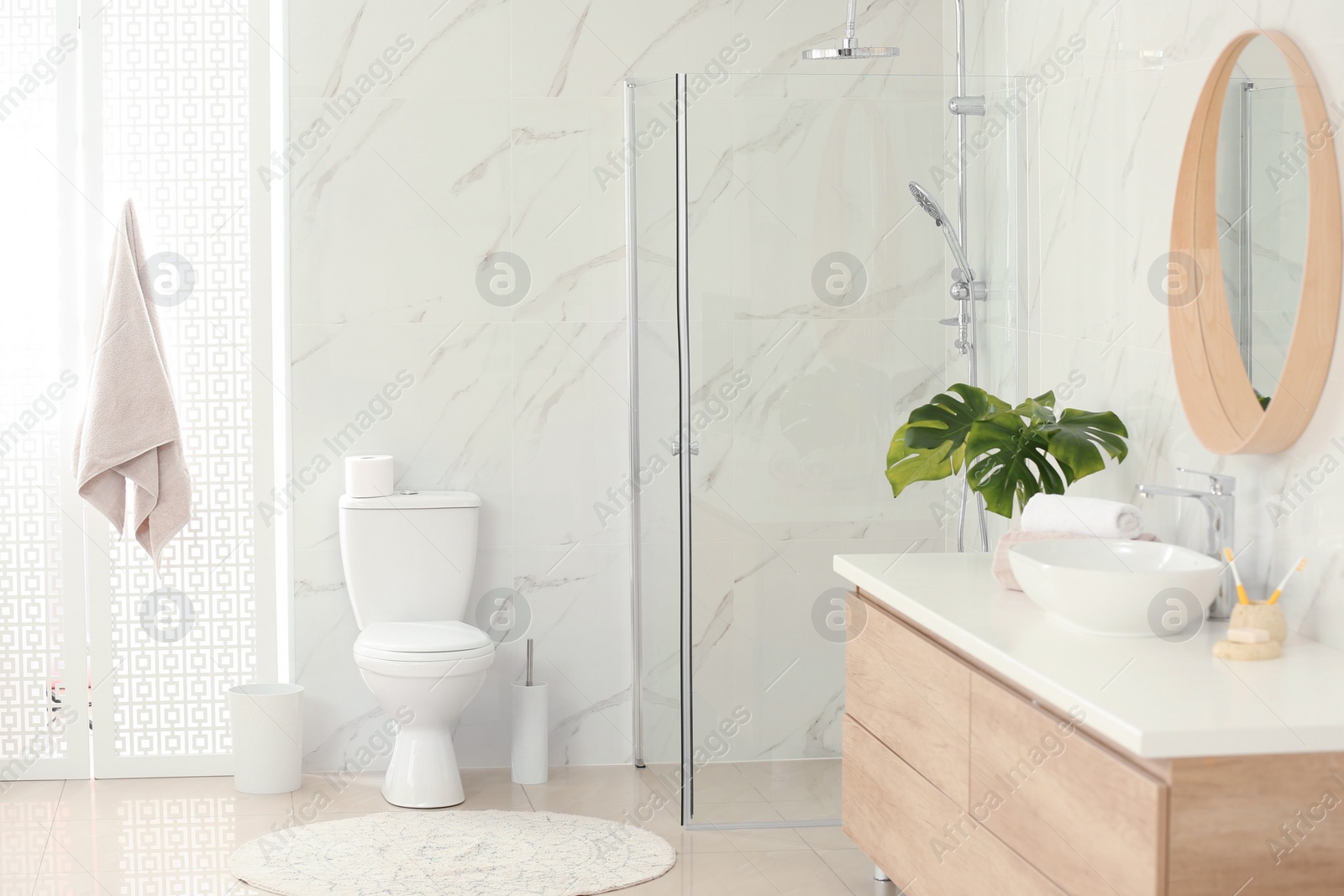 Photo of Interior of modern bathroom with toilet bowl