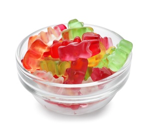 Glass bowl with delicious jelly bears on white background