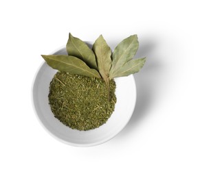 Whole and ground bay leaves in bowl on white background, top view