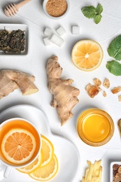 Flat lay composition with tea and therapeutic products on white background