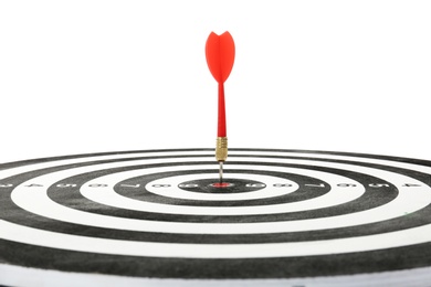 Photo of Red arrow hitting target on dart board against white background