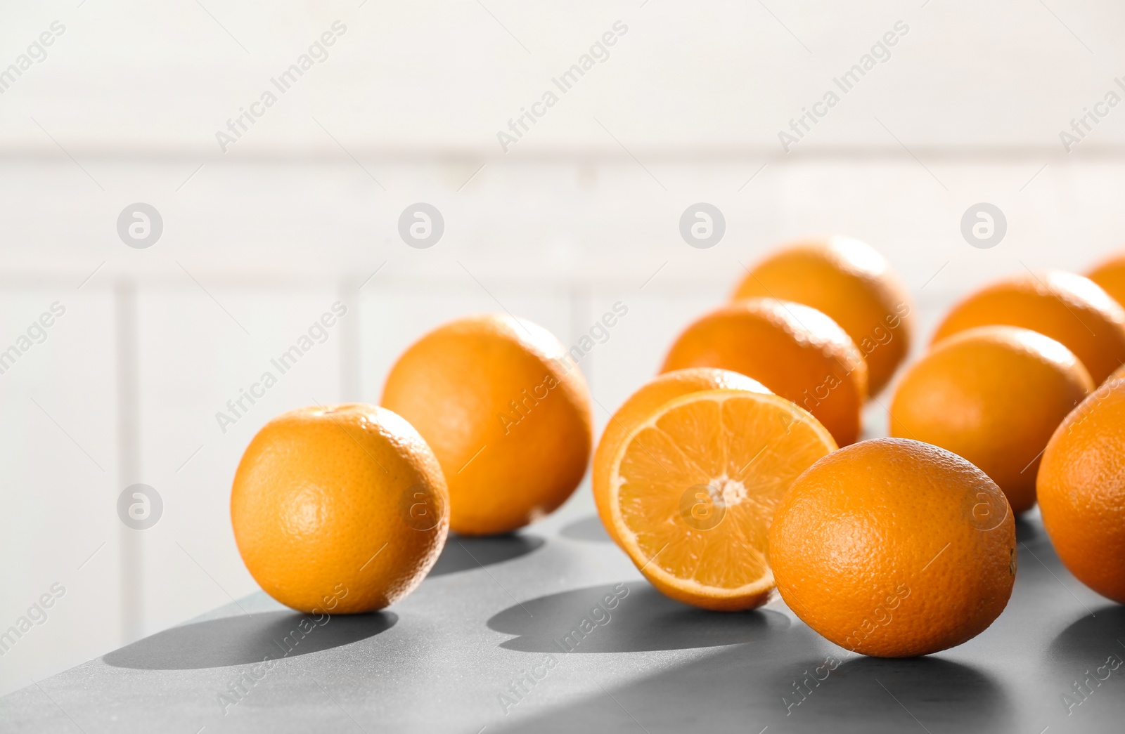 Photo of Fresh juicy oranges on table, space for text. Healthy fruits