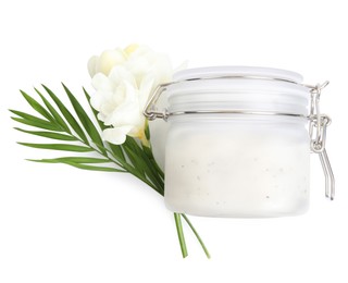 Photo of Jar of exfoliating salt scrub, palm leaf and freesia flowers on white background, top view