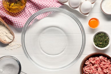 Photo of Bowl and different products on white wooden table, flat lay