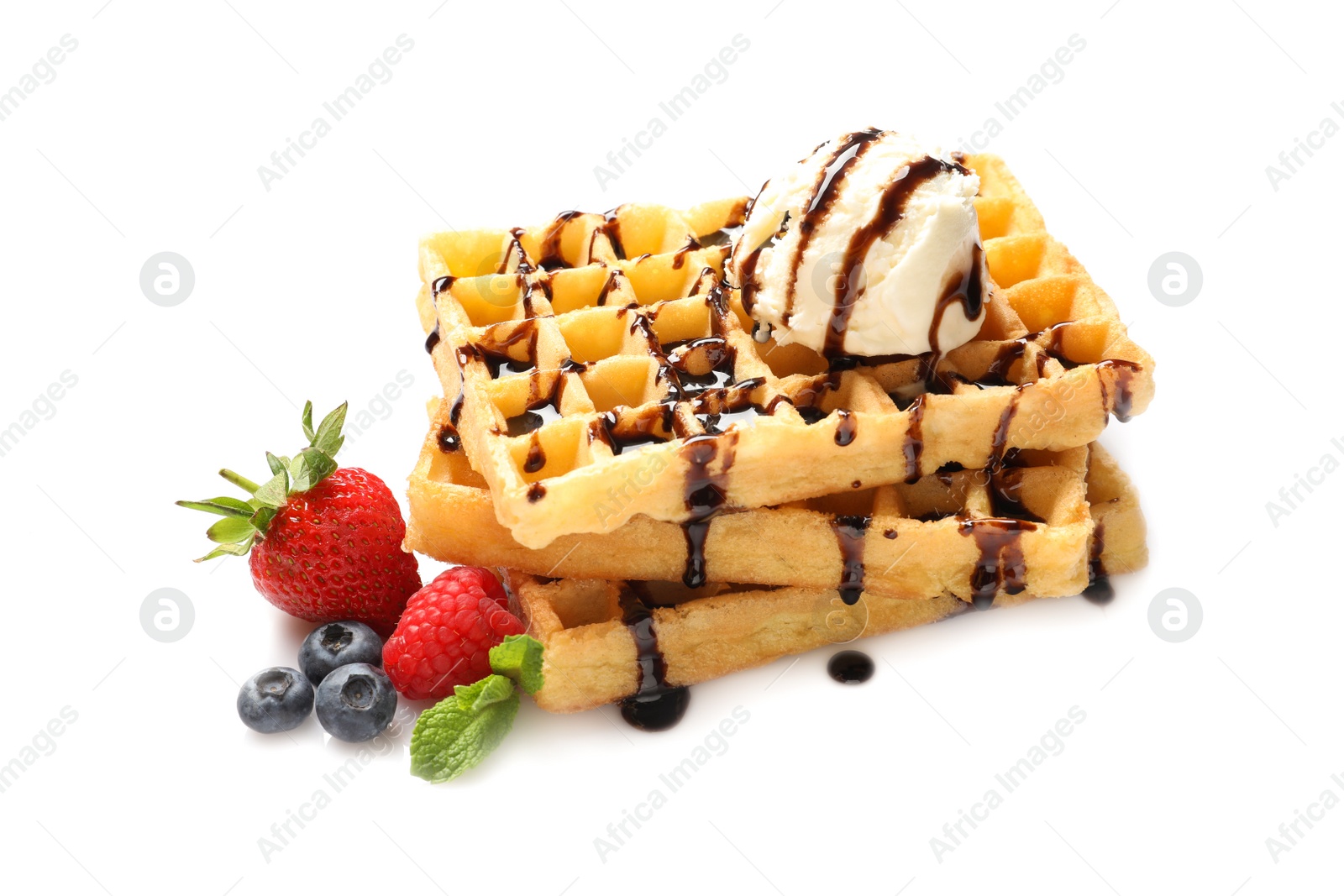 Photo of Delicious waffles with berries, ice cream and chocolate syrup on white background