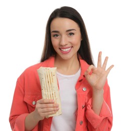 Photo of Happy young woman with tasty shawarma showing okay gesture isolated on white