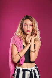 Photo of Beautiful young woman posing on color background. Summer fashion