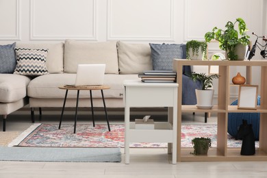 Photo of Stylish living room with beautiful carpet and modern furniture. Interior design