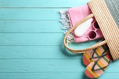 Photo of Flat lay composition with beach accessories on color wooden background. Space for text