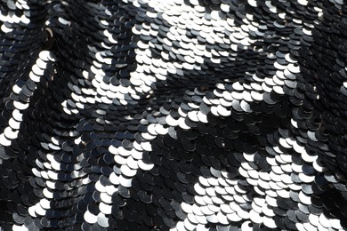 Photo of Texture of beautiful bright sequins as background, closeup