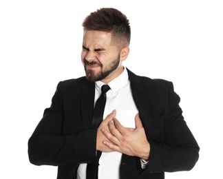 Photo of Businessman suffering from heart pain on white background