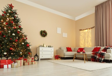 Photo of Beautiful tree decorated for Christmas in room with stylish furniture. Interior design