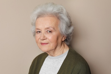 Photo of Portrait of mature woman on color background