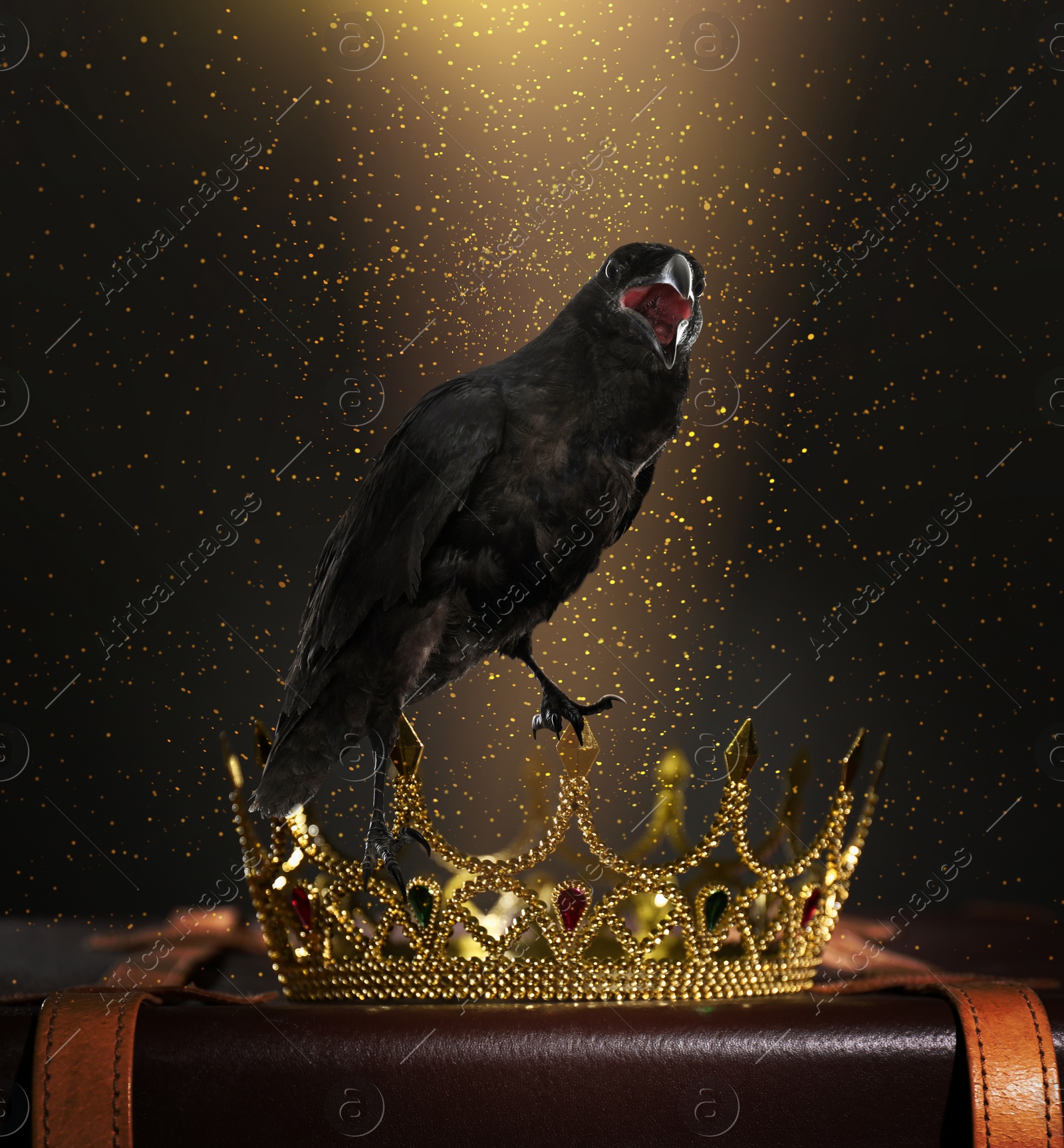 Image of Fantasy world. Black crow lit by magic light sitting on golden crown 