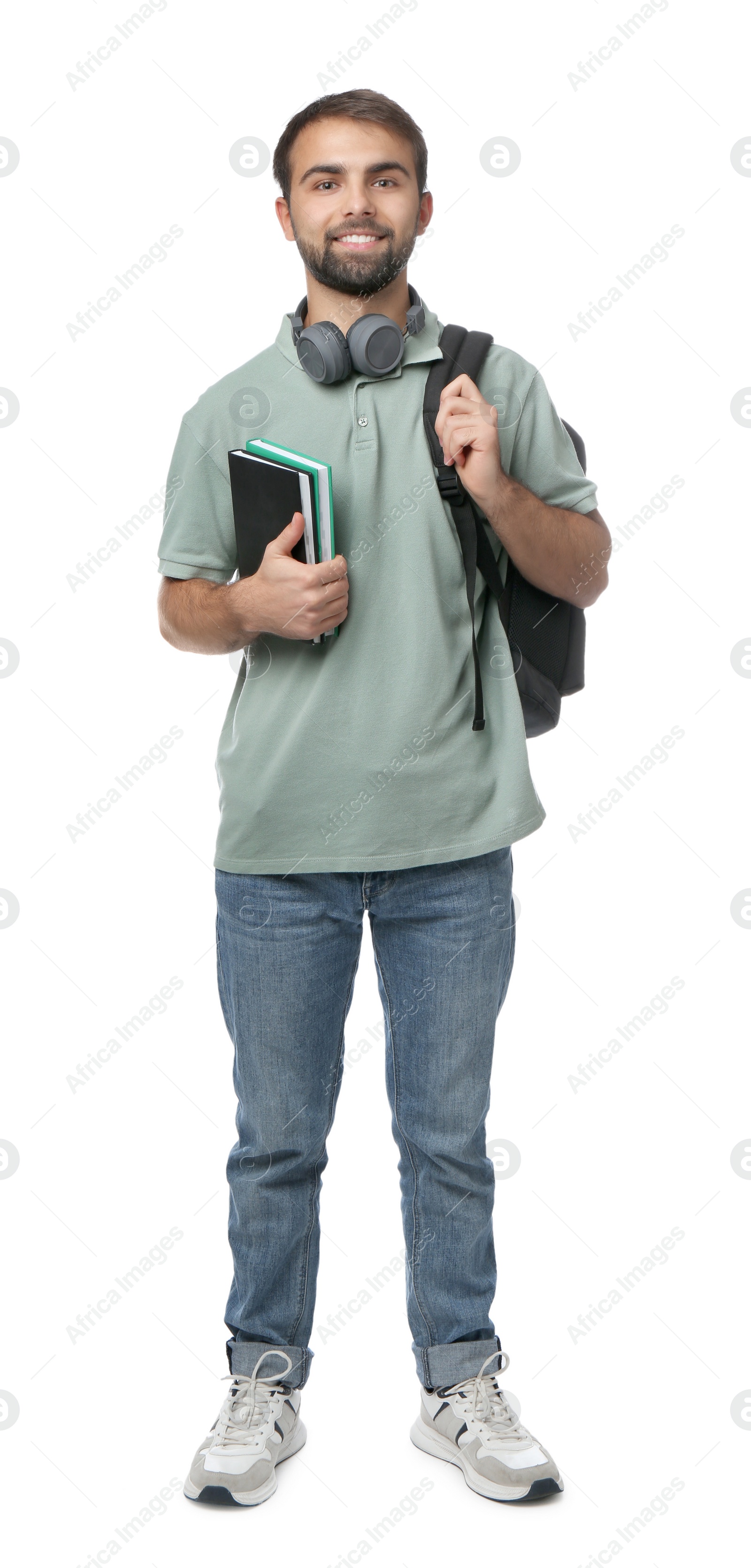 Photo of Student with headphones, backpack and books on white background