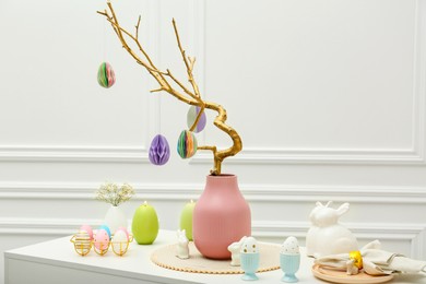 Photo of Beautiful festive composition with Easter decor on white table indoors