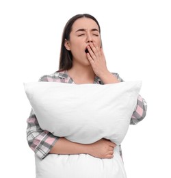Photo of Tired young woman with pillow yawning on white background. Insomnia problem