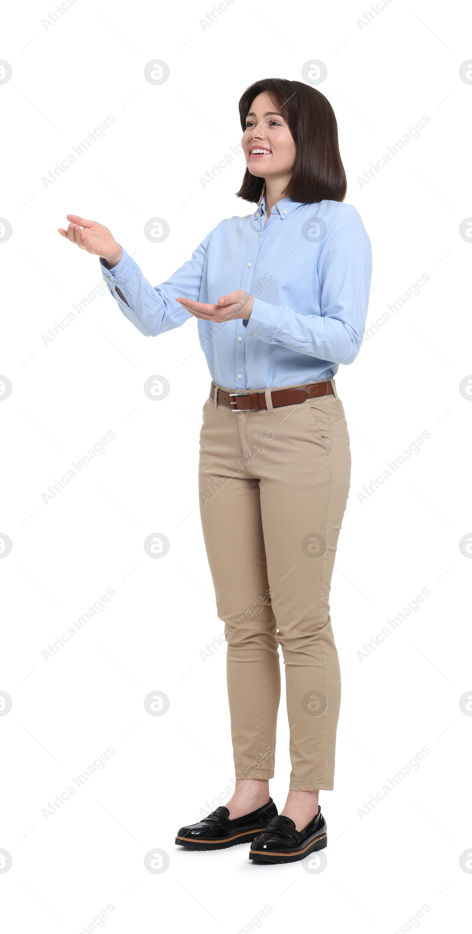 Photo of Happy businesswoman in blue shirt and beige pants on white background