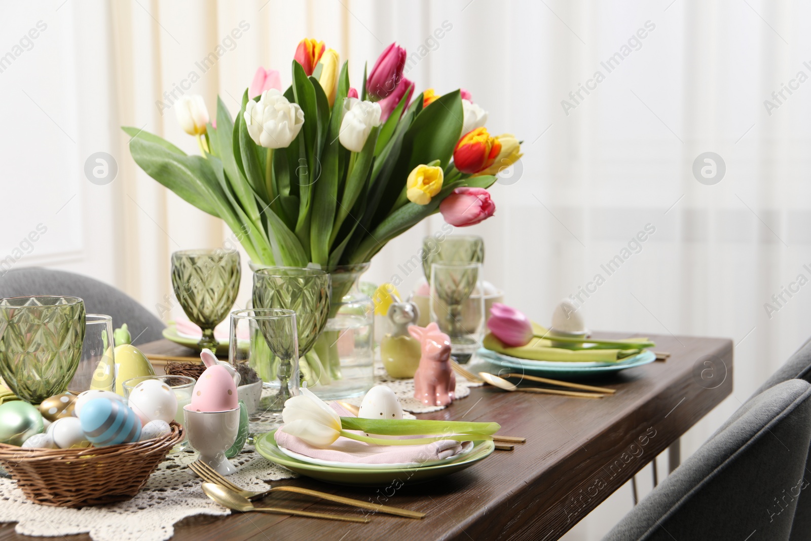 Photo of Festive table setting with beautiful flowers. Easter celebration