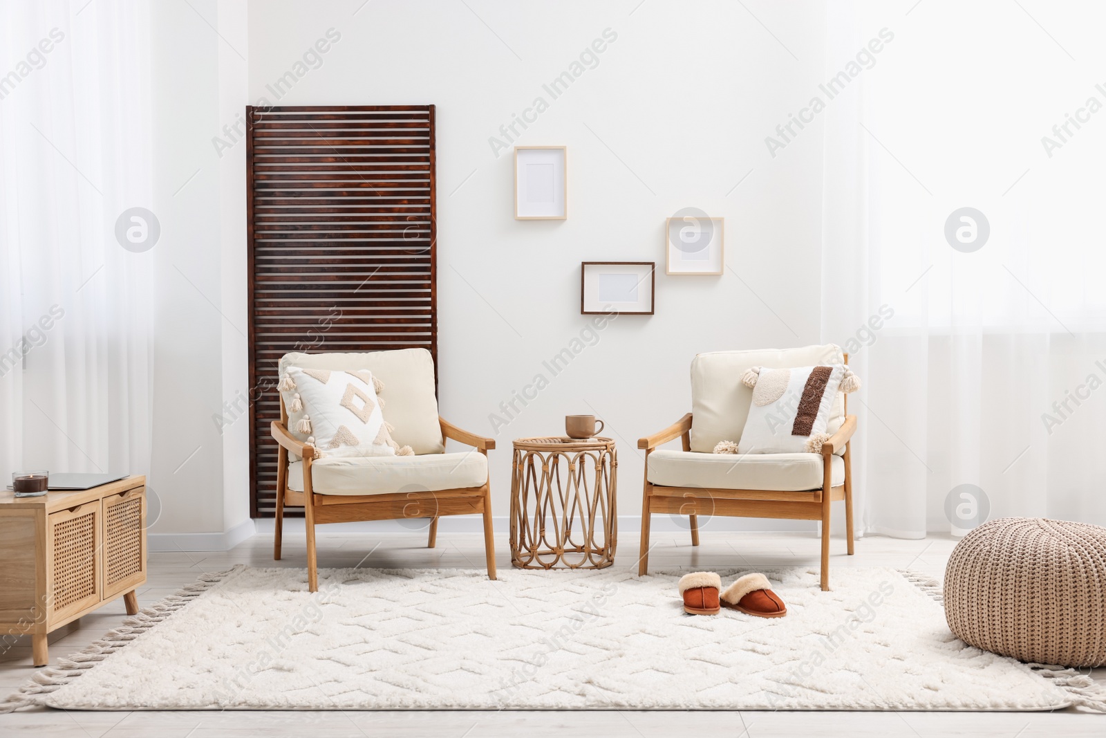 Photo of Stylish living room with soft white carpet and furniture. Interior design