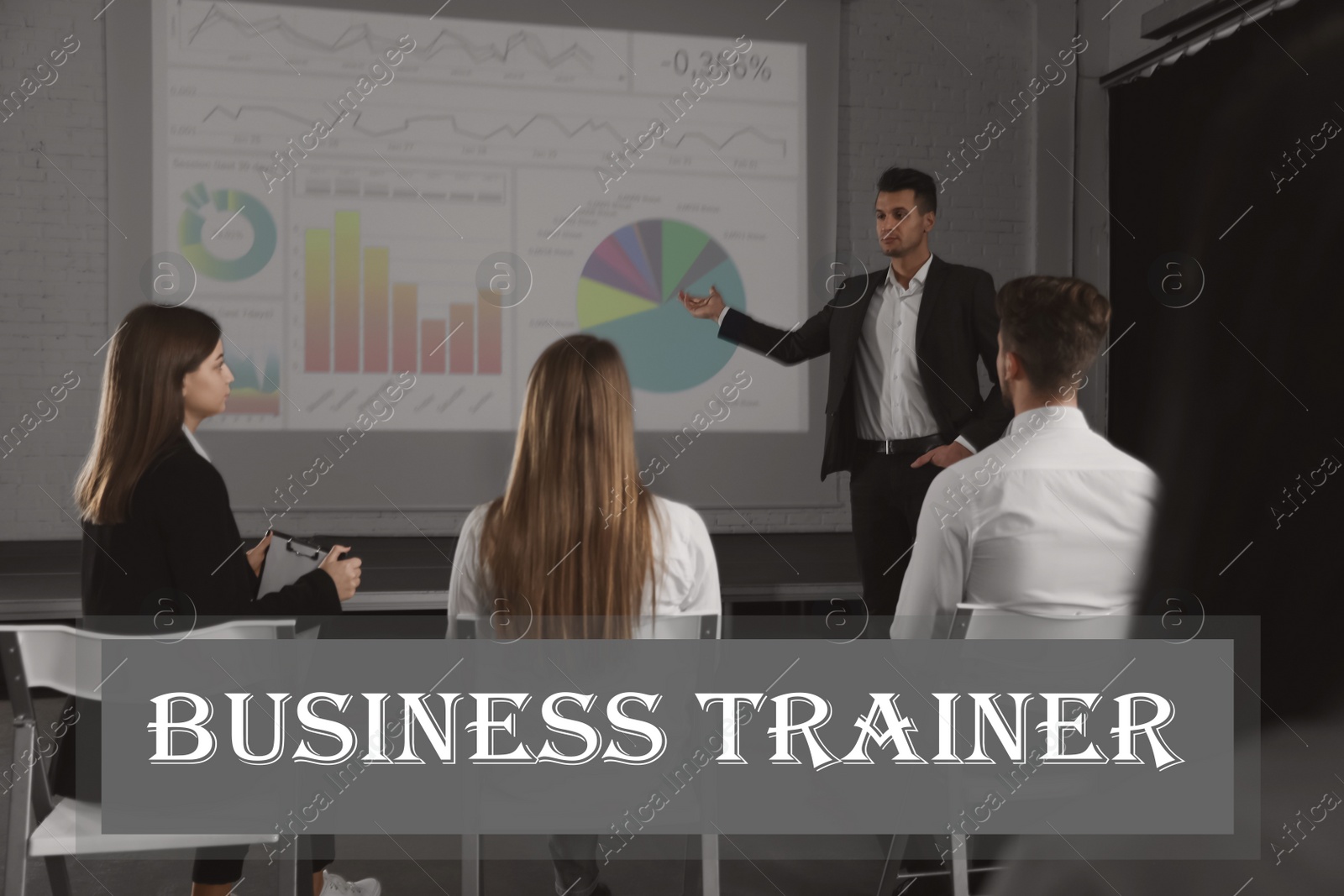 Image of Professional business trainer giving lecture in conference room with projection screen