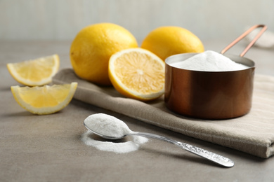 Photo of Baking soda and cut lemons on light table