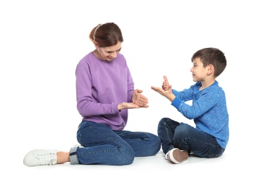 Hearing impaired mother and her child talking with help of sign language on white background