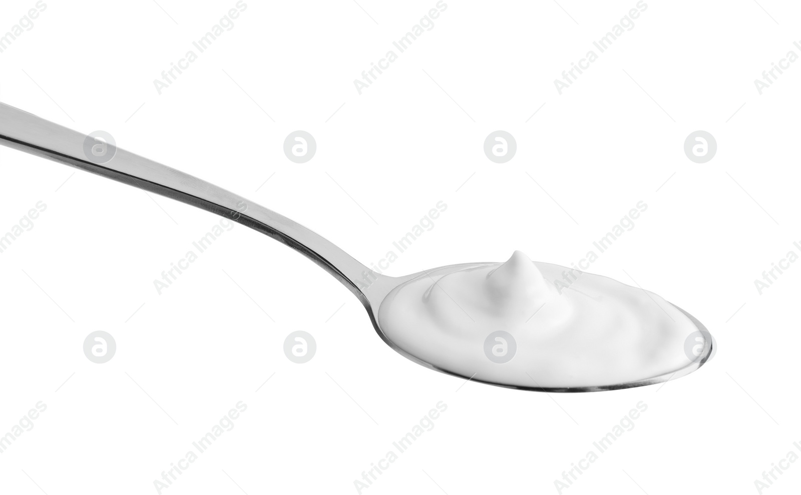 Photo of One silver spoon with sour cream isolated on white