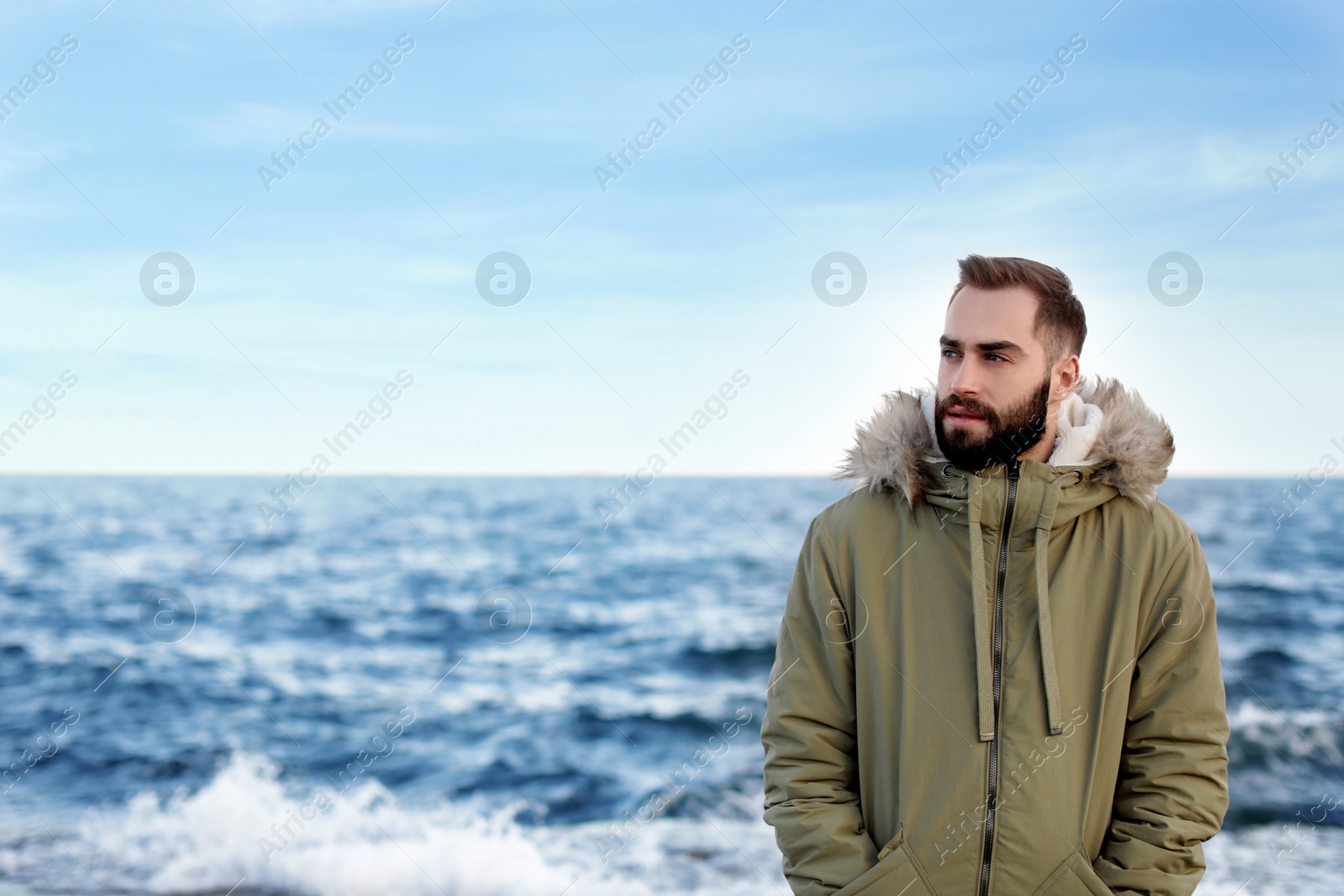 Photo of Portrait of handsome young man near sea