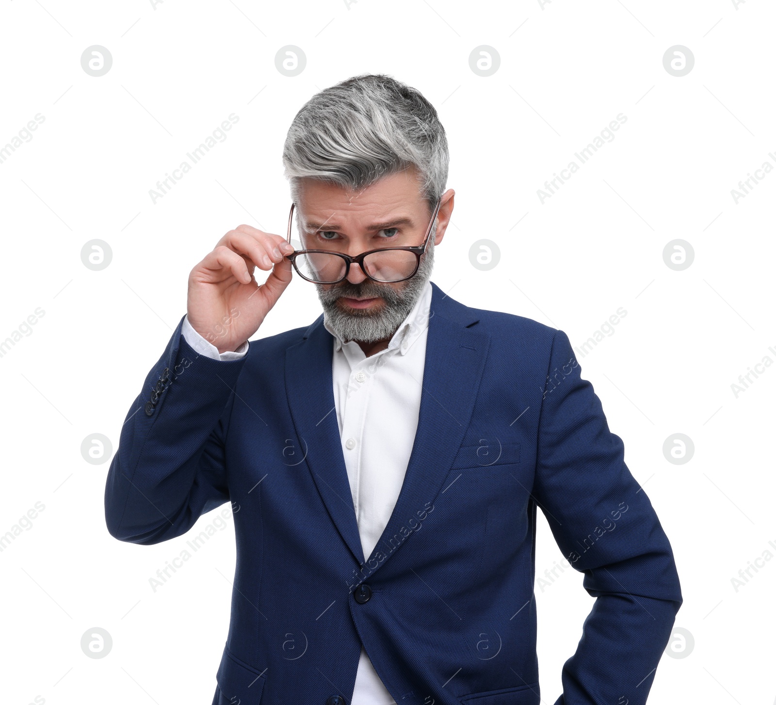 Photo of Mature businessman in stylish clothes posing on white background, low angle view