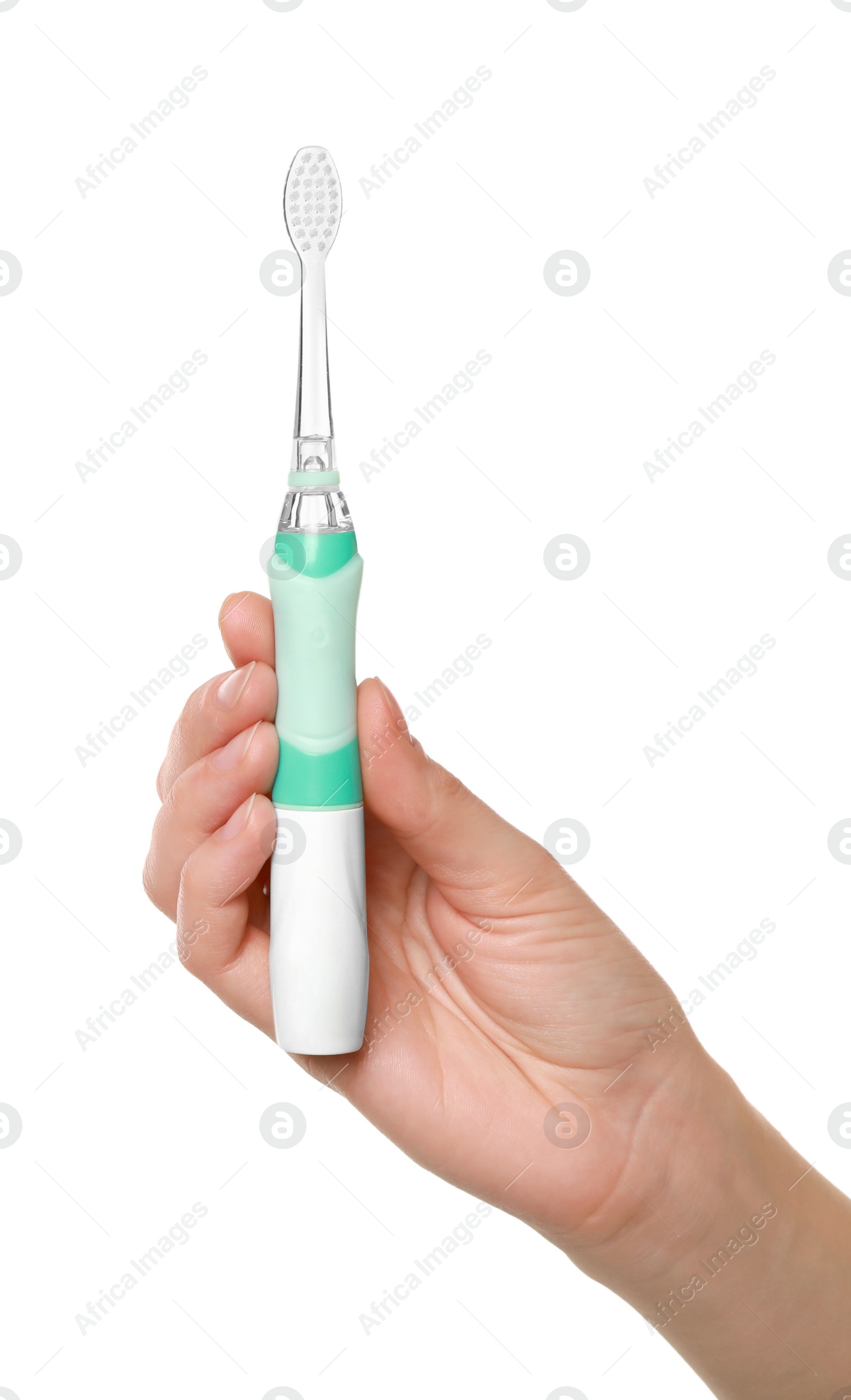 Photo of Woman holding electric toothbrush on white background, closeup